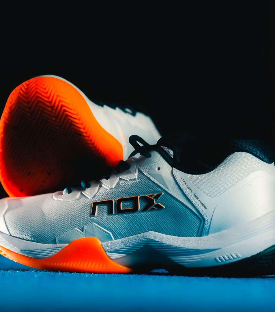 NOX padel shoe in white with orange sole